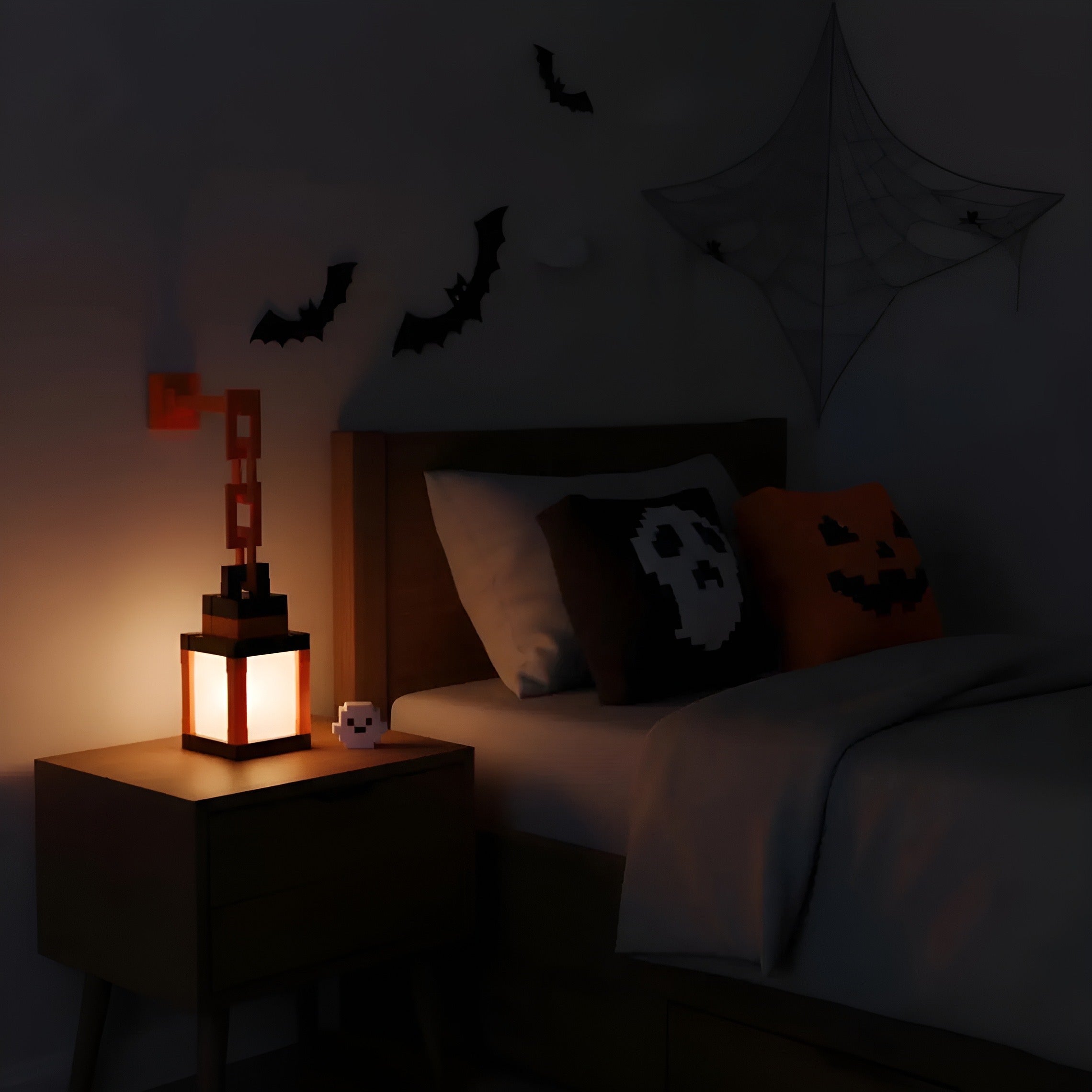 Halloween-themed bedroom with lit lamp, ghost pillow, and spider web.